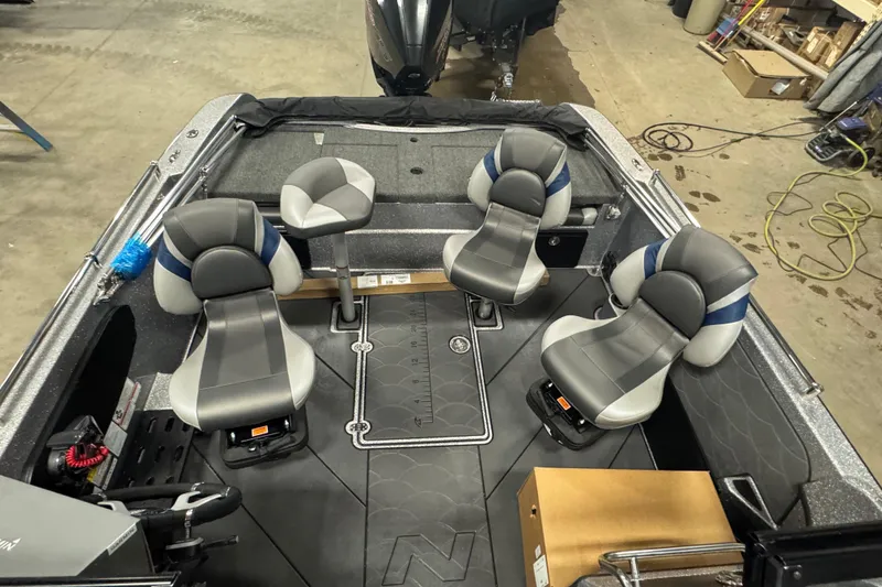 Slide: The Image of 2026 Nitro ZV19 Sport Pro boat interior with four gray seats and storage compartments. - 5