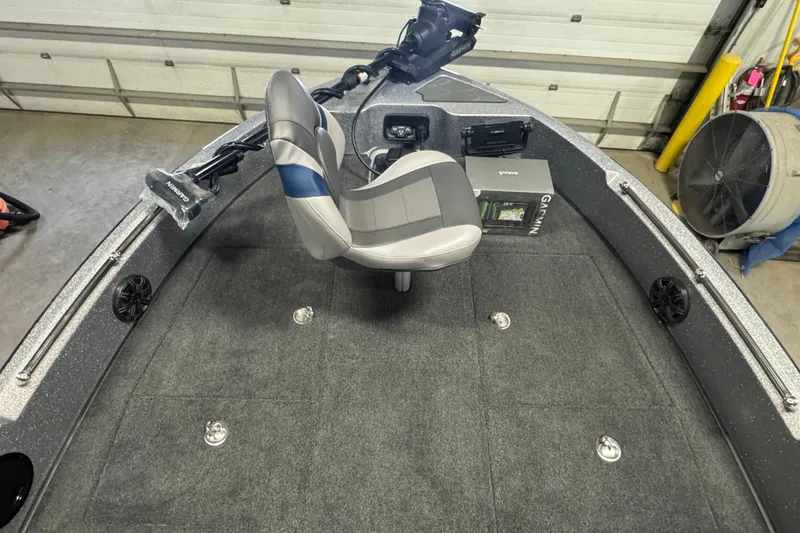 Slide: The Image of 2026 Nitro ZV19 Sport Pro boat interior with gray seating and Garmin equipment. - 6