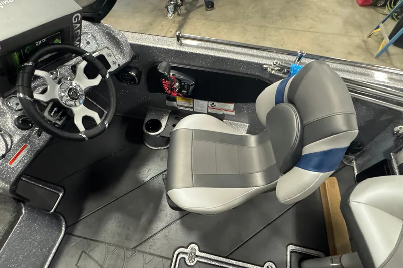 Slide: The Image of Interior of 2026 Nitro ZV19 Sport Pro boat with steering wheel and seat. - 7