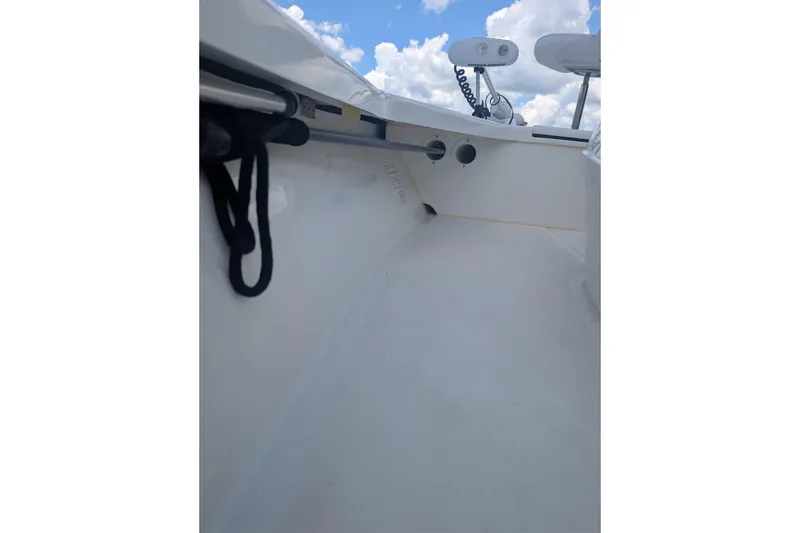 Slide: The Image of Interior view of a 2024 Mako 18 LTS boat under a blue sky. - 11