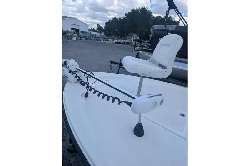 Slide: The Image of 2024 Mako 18 LTS boat with white seat and trolling motor. - 6