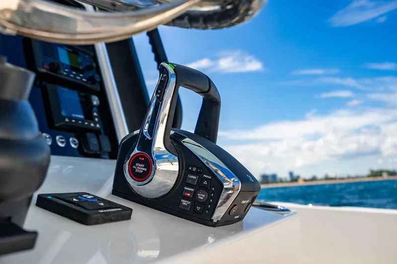 Slide: The Image of Control panel of 2026 Reef Runner 280 boat with ocean view. - 15