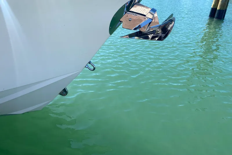 Slide: The Image of Bow of 2026 Reef Runner 280 boat with anchor over turquoise water. - 25