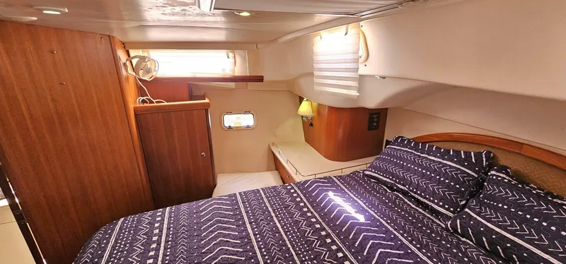 Slide: The Image of Luxurious cabin interior of 2007 Hunter 45 Center Cockpit yacht with cozy bedding. - 11