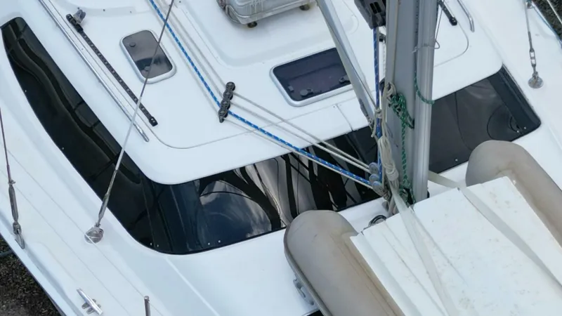 Slide: The Image of Hunter 45 Center Cockpit sailboat deck, 2007 model, featuring rigging and hatches. - 28