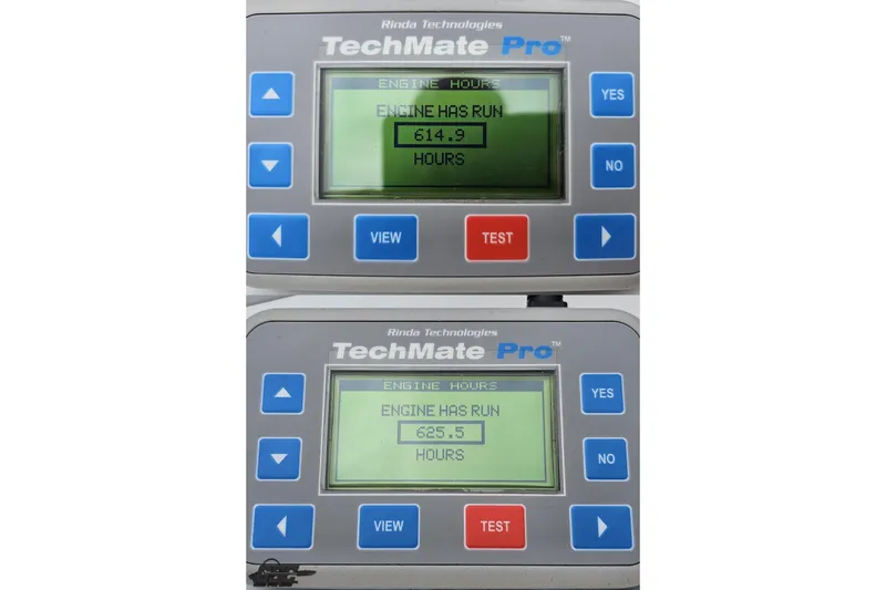 Slide: The Image of TechMate Pro engine hour meters showing 614.9 and 625.5 hours for 2001 Formula 382 FASTech. - 101