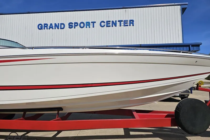 Slide: The Image of 2001 Formula 382 FASTech boat on red trailer at Grand Sport Center. - 15