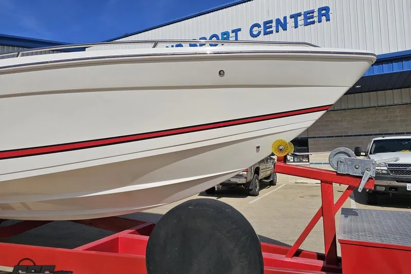 Slide: The Image of 2001 Formula 382 FASTech boat on trailer at a marine center. - 18