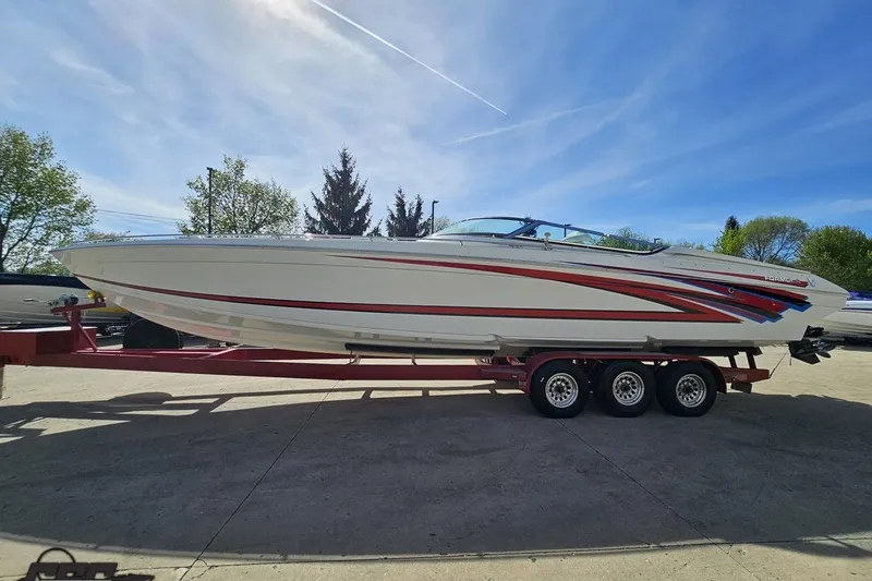 Slide: The Image of 2001 Formula 382 FASTech boat on trailer, featuring sleek design and vibrant graphics. - 22