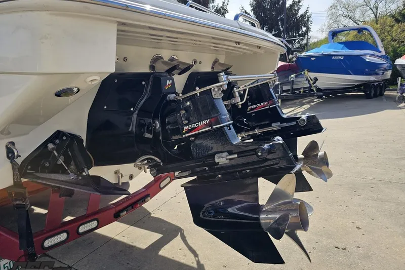 Slide: The Image of 2001 Formula 382 FASTech boat with dual Mercury outboard engines, parked on a trailer. - 30