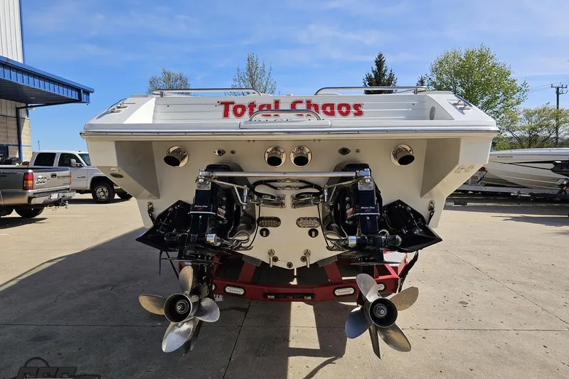 Slide: The Image of Rear view of a 2001 Formula 382 FASTech boat named "Total Chaos" with dual propellers. - 32