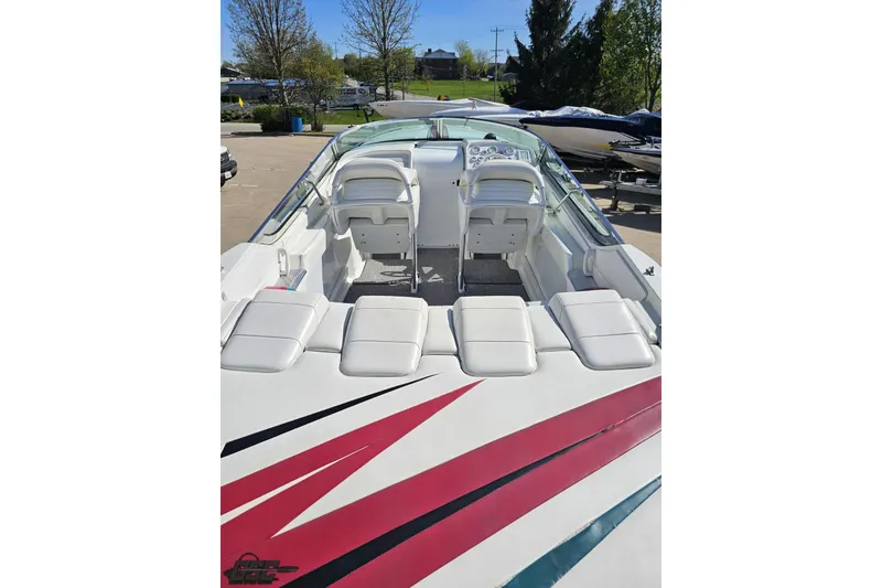 Slide: The Image of 2001 Formula 382 FASTech boat interior with white seating and vibrant red accents. - 36