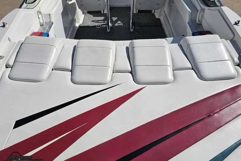 Slide: The Image of 2001 Formula 382 FASTech boat interior with white seating and red accents. - 38