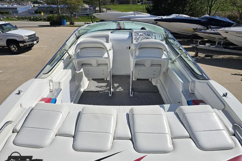 Slide: The Image of 2001 Formula 382 FASTech boat interior with white seating and dashboard view. - 39