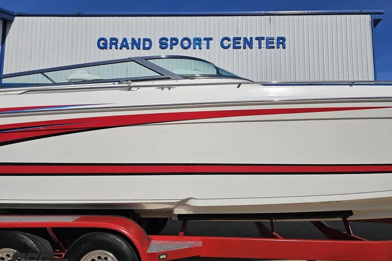Slide: The Image of 2001 Formula 382 FASTech boat with red accents at Grand Sport Center. - 4