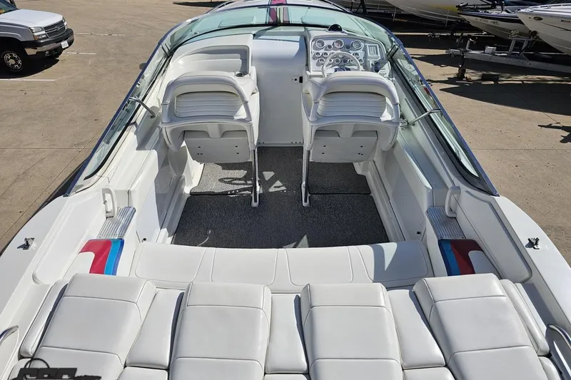 Slide: The Image of 2001 Formula 382 FASTech boat interior with white seating and dashboard controls. - 40