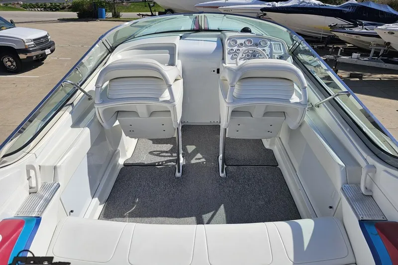 Slide: The Image of 2001 Formula 382 FASTech boat interior with white seating and control panel. - 41
