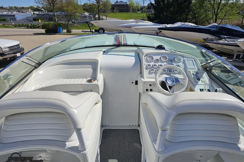 Slide: The Image of 2001 Formula 382 FASTech boat cockpit with white leather seats and modern dashboard. - 44