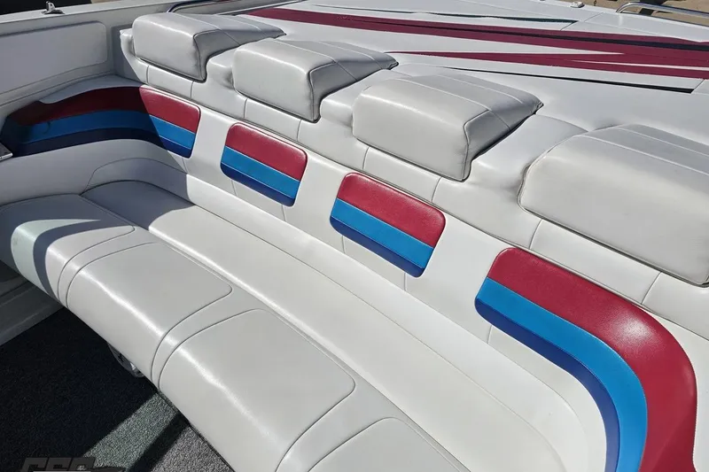 Slide: The Image of 2001 Formula 382 FASTech boat interior with white, red, and blue cushioned seating. - 45