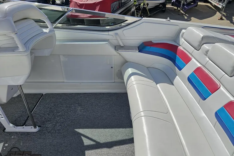 Slide: The Image of Interior of a 2001 Formula 382 FASTech boat with white, red, and blue seating. - 46