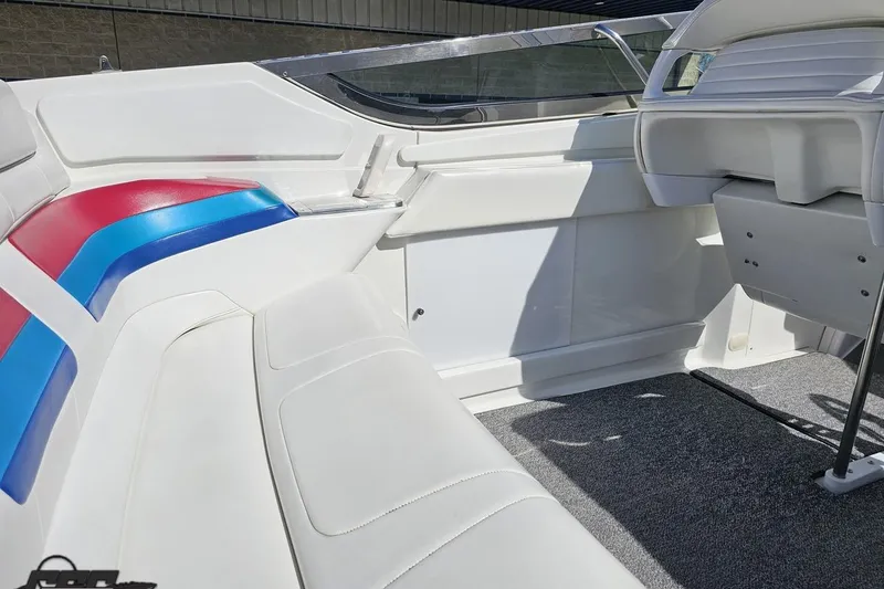 Slide: The Image of 2001 Formula 382 FASTech boat interior with white, red, and blue seating. - 47