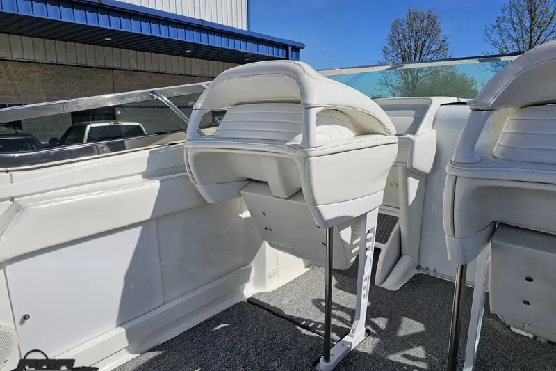 Slide: The Image of Interior of a 2001 Formula 382 FASTech boat with white seating and modern design. - 48