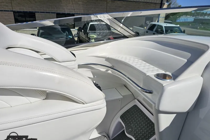 Slide: The Image of 2001 Formula 382 FASTech boat interior with white seating and chrome accents. - 50