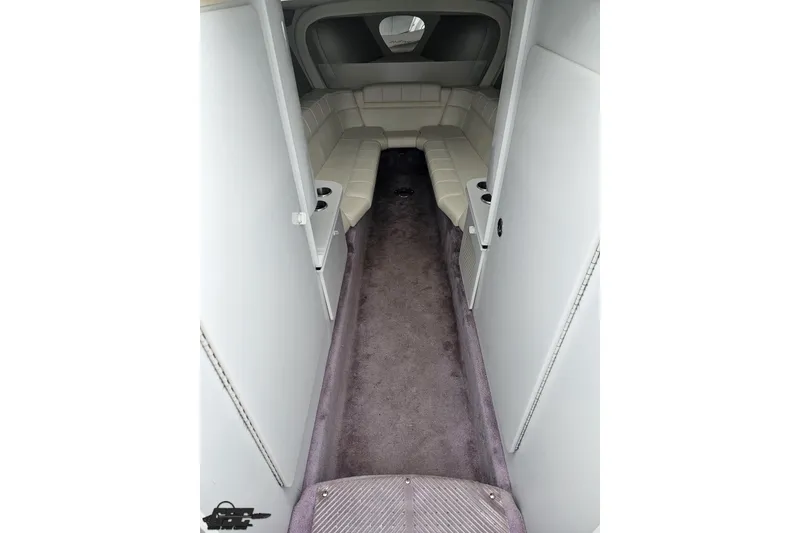 Slide: The Image of Interior cabin of a 2001 Formula 382 FASTech boat with plush seating and carpet. - 52