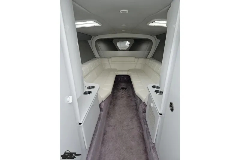 Slide: The Image of Interior of a 2001 Formula 382 FASTech boat with white seating and carpeted floor. - 53