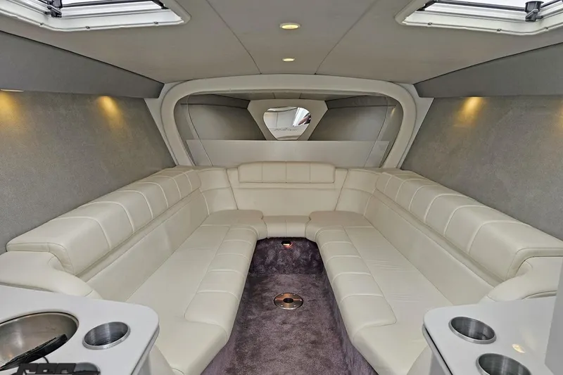 Slide: The Image of Luxurious interior of a 2001 Formula 382 FASTech boat with plush seating and modern design. - 54