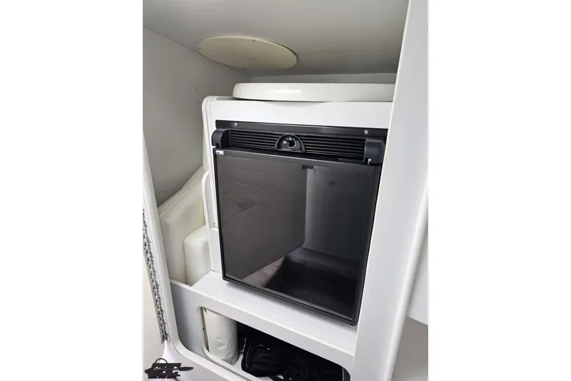 Slide: The Image of Compact refrigerator inside 2001 Formula 382 FASTech boat cabin. - 56