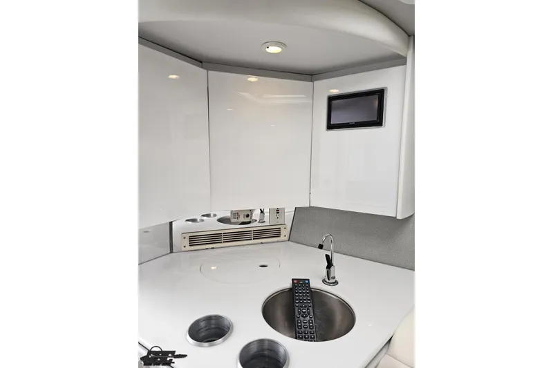 Slide: The Image of Interior of 2001 Formula 382 FASTech boat with sink, remote, and small screen. - 57