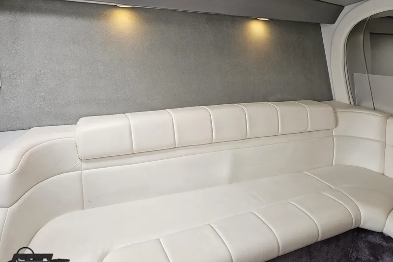 Slide: The Image of Interior of 2001 Formula 382 FASTech boat with white leather seating and ambient lighting. - 58