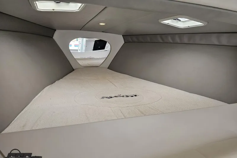 Slide: The Image of Interior cabin of a 2001 Formula 382 FASTech boat, featuring sleek design and comfortable bedding. - 60