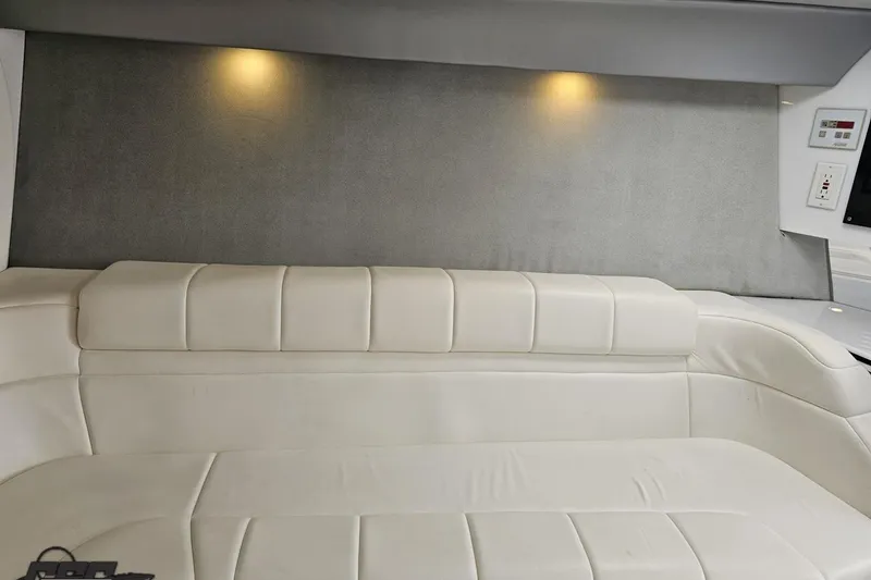Slide: The Image of Interior of a 2001 Formula 382 FASTech boat with white leather seating. - 62