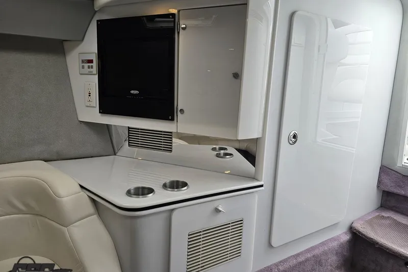 Slide: The Image of Interior of a 2001 Formula 382 FASTech boat with sleek cabinetry and seating. - 63