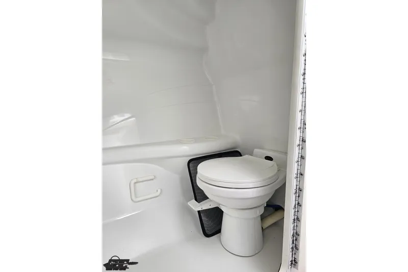 Slide: The Image of 2001 Formula 382 FASTech boat interior bathroom with white marine toilet. - 66