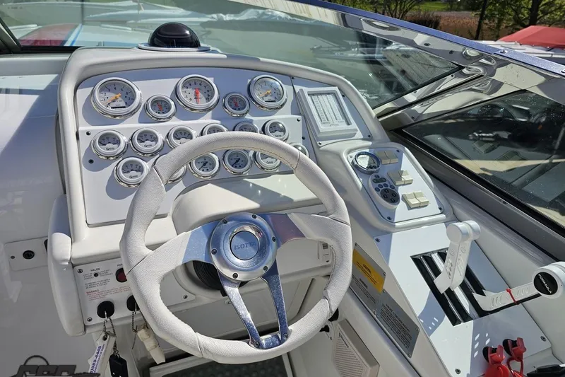 Slide: The Image of Cockpit of 2001 Formula 382 FASTech boat with steering wheel and instrument panel. - 72