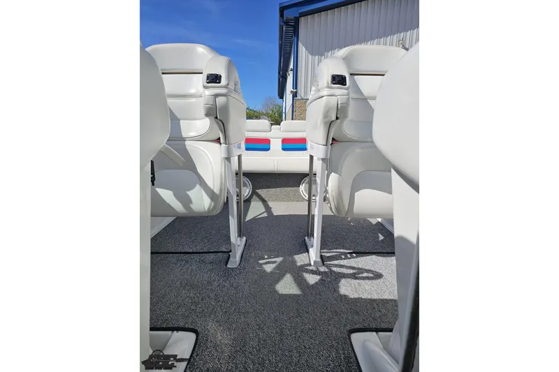 Slide: The Image of 2001 Formula 382 FASTech boat interior with white seating and carpeted flooring. - 77