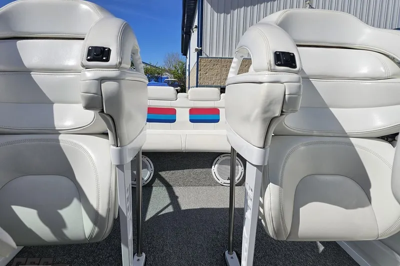 Slide: The Image of Interior of 2001 Formula 382 FASTech boat with white leather seats and colorful accents. - 78