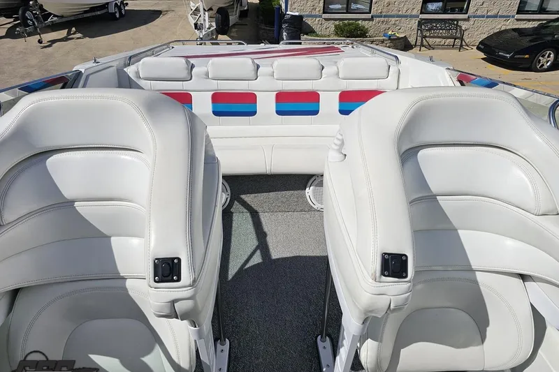 Slide: The Image of 2001 Formula 382 FASTech boat interior with white leather seats and colorful accents. - 82