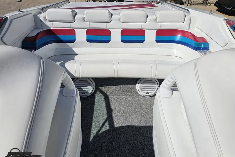 Slide: The Image of Interior of a 2001 Formula 382 FASTech boat with white, red, and blue seating. - 84
