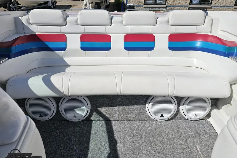 Slide: The Image of Interior of 2001 Formula 382 FASTech boat with white seating and colorful accents. - 85