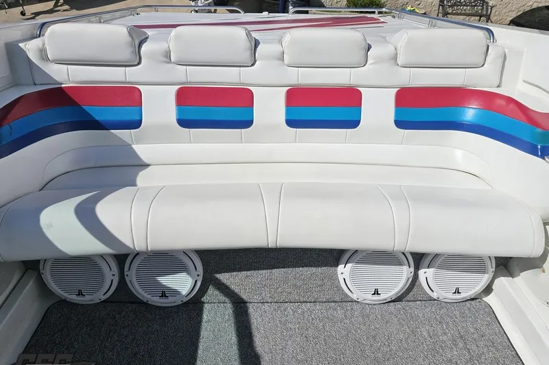 Slide: The Image of 2001 Formula 382 FASTech boat interior with white seating and colorful accents. - 86