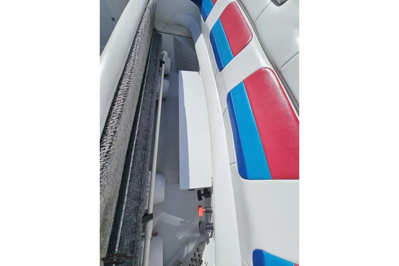 Slide: The Image of 2001 Formula 382 FASTech boat interior with red, blue, and white seating. - 92