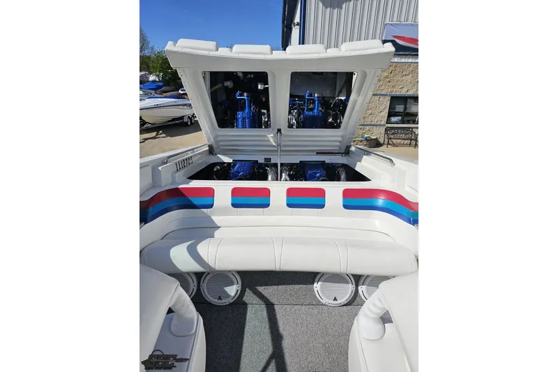 Slide: The Image of 2001 Formula 382 FASTech boat with open engine compartment, showcasing powerful engines. - 93