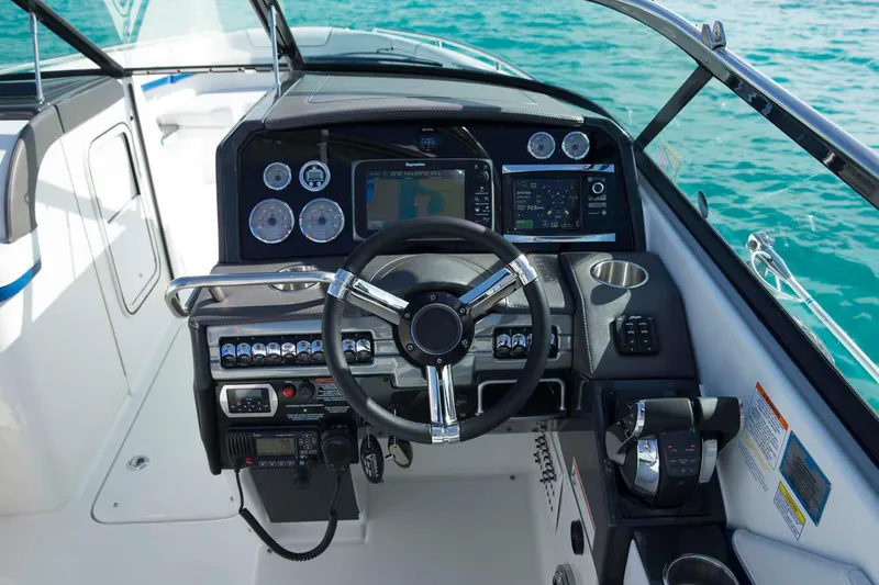 Slide: The Image of Manufacturer Provided Image: 2016 Formula 310 Bowrider dashboard with steering wheel and navigation controls. - 6
