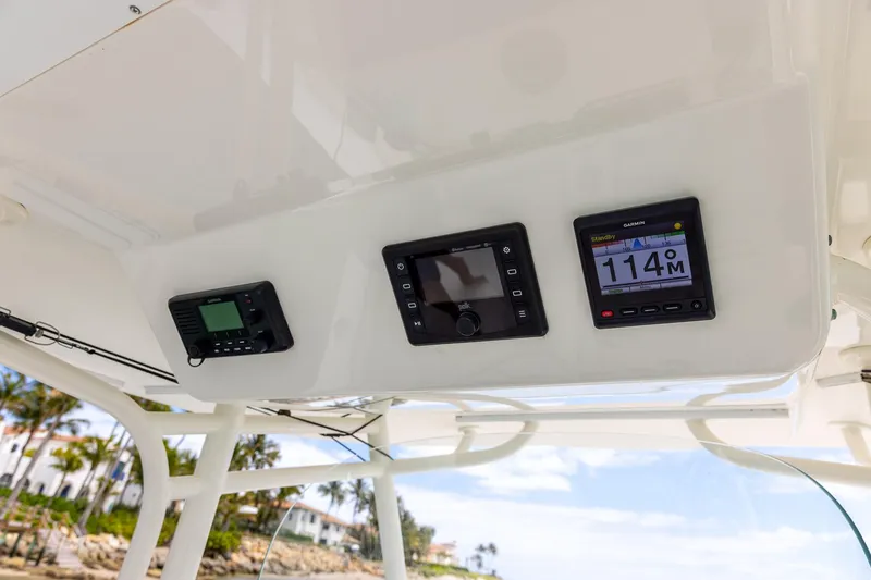 Slide: The Image of 2018 Regulator 28 boat dashboard with Garmin navigation displays. - 20