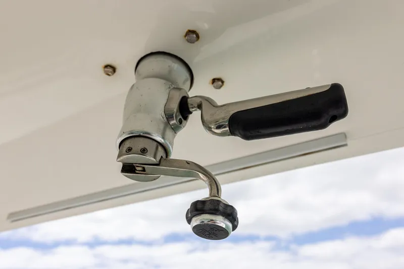 Slide: The Image of Close-up of a 2018 Regulator 28 boat handle against a cloudy sky background. - 21