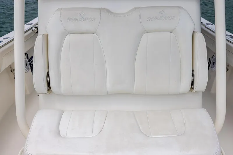 Slide: The Image of White leather seating on a 2018 Regulator 28 boat, showcasing comfort and style. - 25